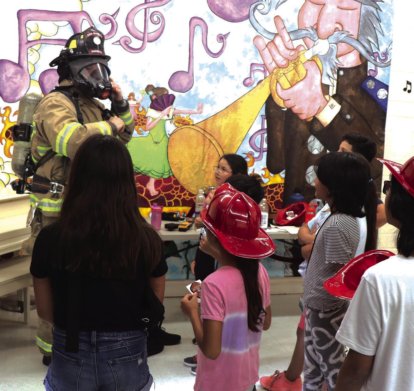 Firefighters visit children at Centro Cultural Hispano de San Marcos