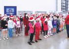 Mendez Striker Choir sings Christmas carols at local businesses